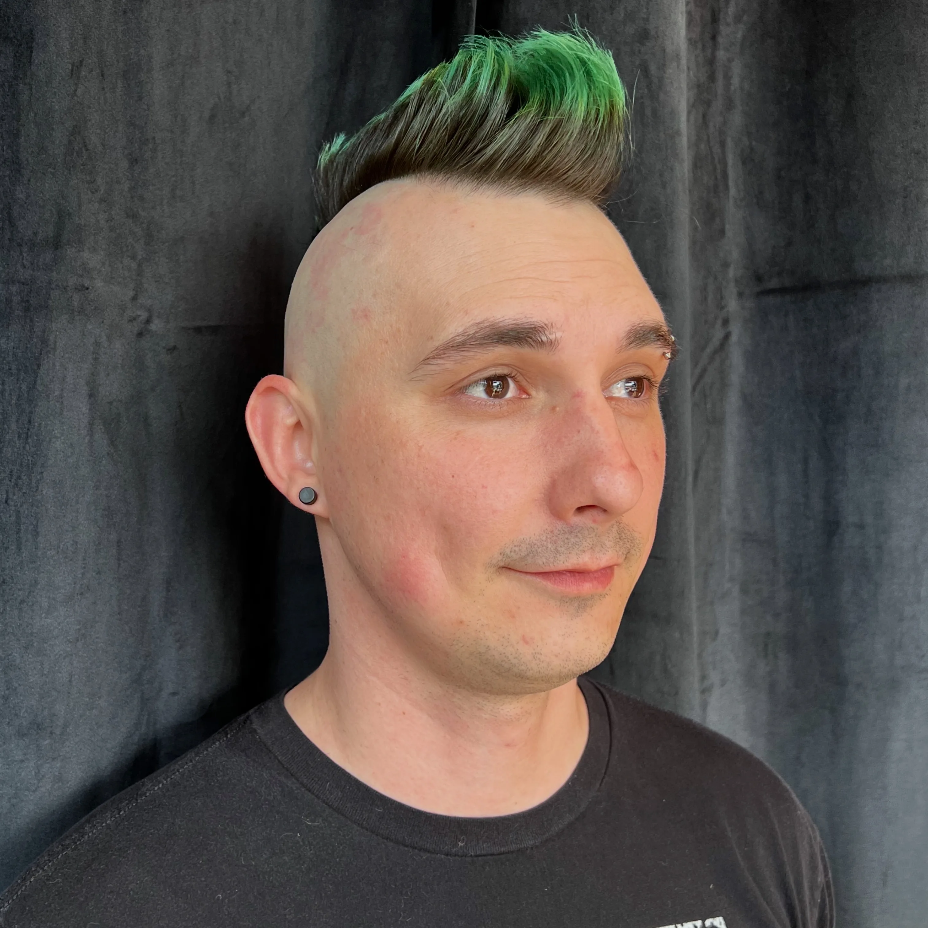 Vivid green mohawk fade haircut at The Gilded Edge, West Seattle barbershop